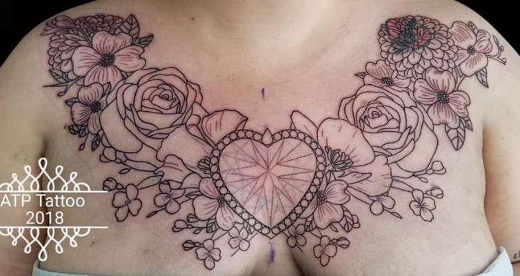 jewels and flowers chestpiece tattoo by Tanya Magdalena